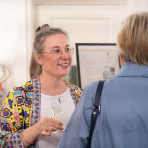 Nina Groth with guests at her vernissage of the exhibition "City & Water - Living Harmony" at KOCH - DIE RAUMHANDWERKEREI